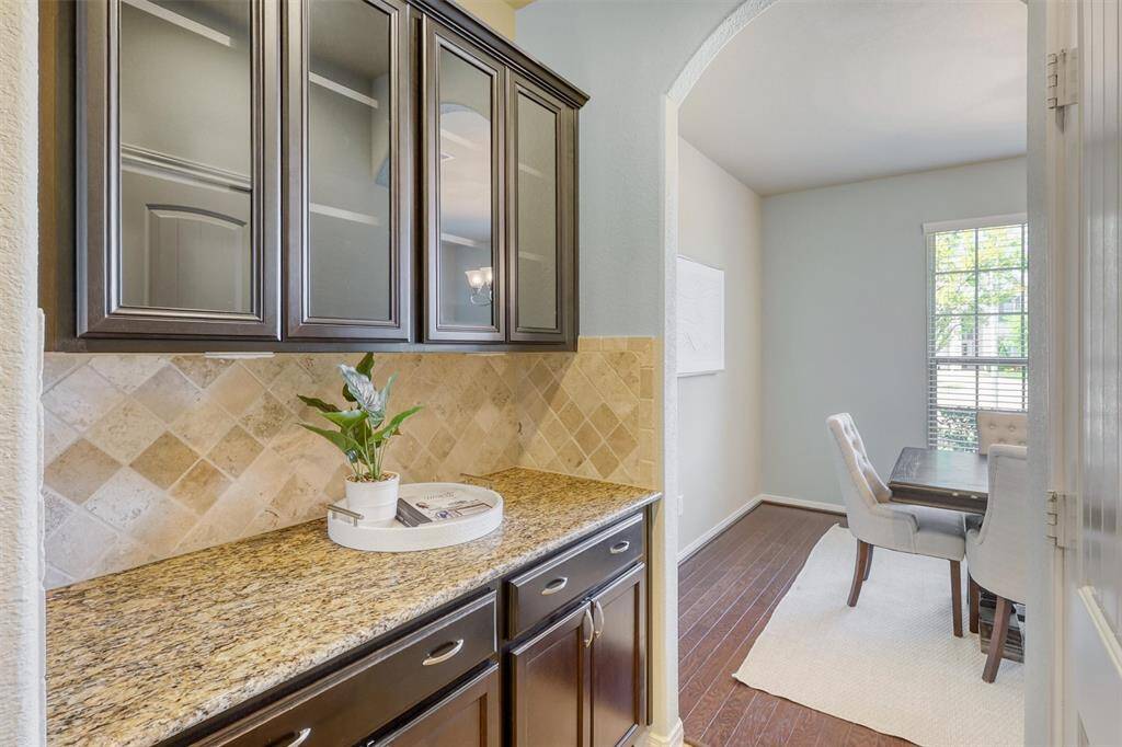 Tucked behind the butler pantry, you'll find a generous dry food pantry that adds functionality and ample storage just steps from the formal dining room.