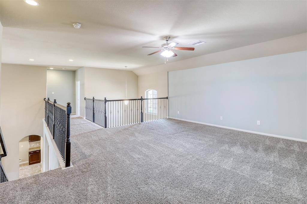 Oversized and open, this upstairs game room is a true bonus—offering endless possibilities for movie nights, play zones, or a home gym setup.