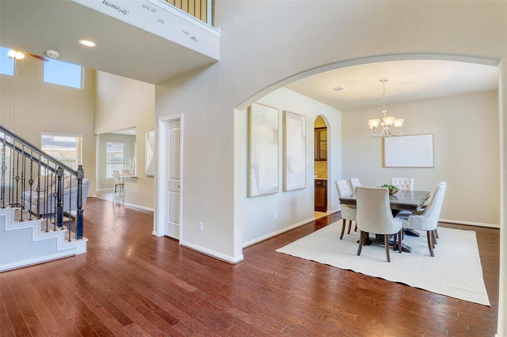 An elegant arched entry guides you seamlessly from the foyer to the formal dining area—perfect for gathering with guests or enjoying intimate family meals in style.