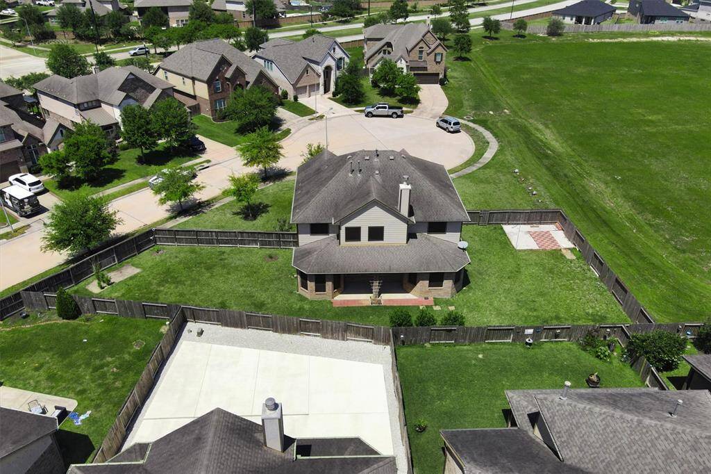 Tucked away on a quiet cul-de-sac, the fenced backyard offers both privacy and peaceful views of the adjacent green space.