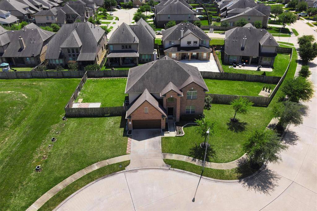 Bird’s-eye view reveals the incredible size of the .3-acre lot, ideally positioned at the curve of a peaceful cul-de-sac—offering a perfect blend of space, privacy, and community vibes.
