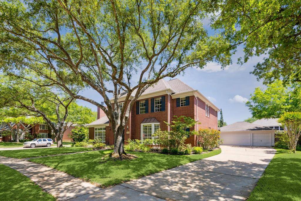 This aerial view captures the full scale of this exceptional corner-lot property, set on .29 acres with a sparkling pool and spa, expansive Cool Deck patio, and ample green space for outdoor fun. Nestled on a quiet cul-de-sac just three doors from the lake and trails, this Cinco Ranch gem offers beauty, privacy, and unbeatable access to resort-style amenities.