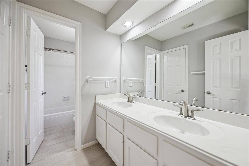 With three very spacious bedrooms upstairs, you will always have room for company. This inviting bedroom features beautiful flooring, fresh paint, a cooling ceiling fan, a large closet, and easy access to a full bathroom offering comfort and convenience for family or visitors alike.