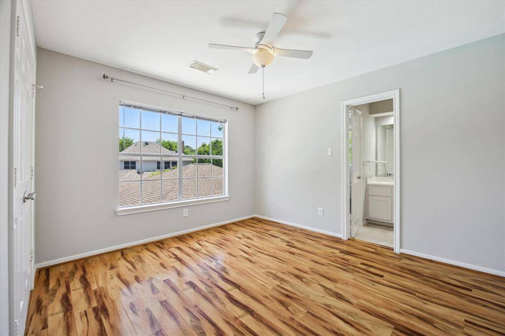 Your family and guests alike will rest comfortably in this roomy bedroom with fresh neutral paint, beautiful flooring, a cooling fan, large closet and easy access to a full bathroom.