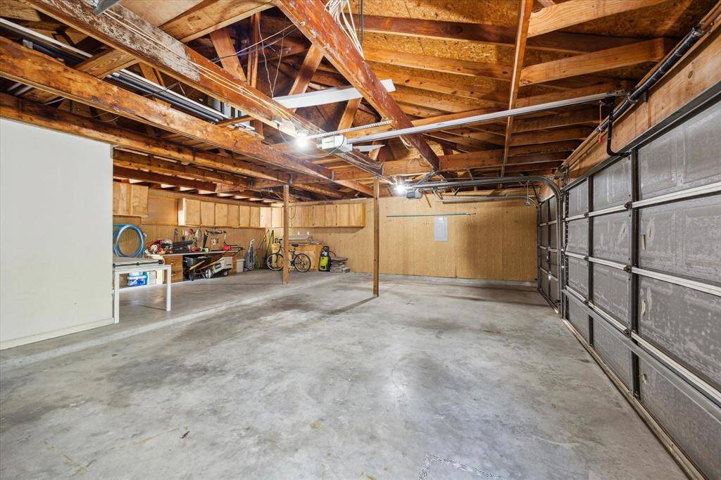 The utility room offers built-ins for household storage, and plenty of space for washer, dryer, and a second refrigerator or freezer. As an added bonus, the washer and dryer are included in the sale!