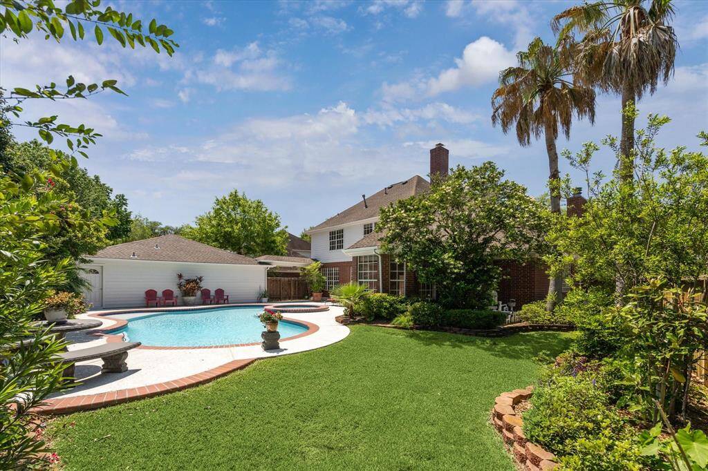 Framed by lush, manicured landscaping and maintained by an automatic sprinkler system, this backyard oasis offers a serene and effortless outdoor escape. The sparkling pool and spa take center stage, while the expansive Cool Deck patio provides generous space for lounging, dining, and entertaining whether you're hosting a weekend barbecue or enjoying a quiet evening under the stars.