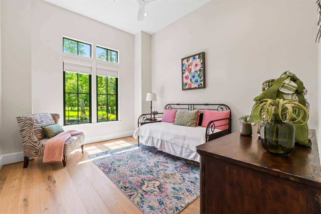 Bright and inviting room with large windows, and an en-suite bathroom.