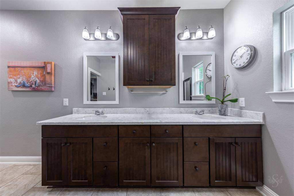 Dual sinks with granite counters.