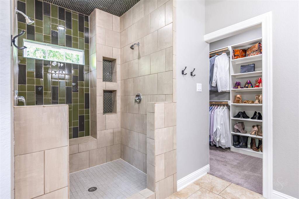 The shower also has a bench seat and inset shelves.