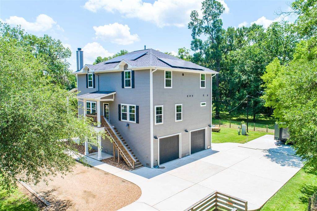 Oversized garage doors provide easy parking for oversized vehicles. Also find a half bath in the garage.