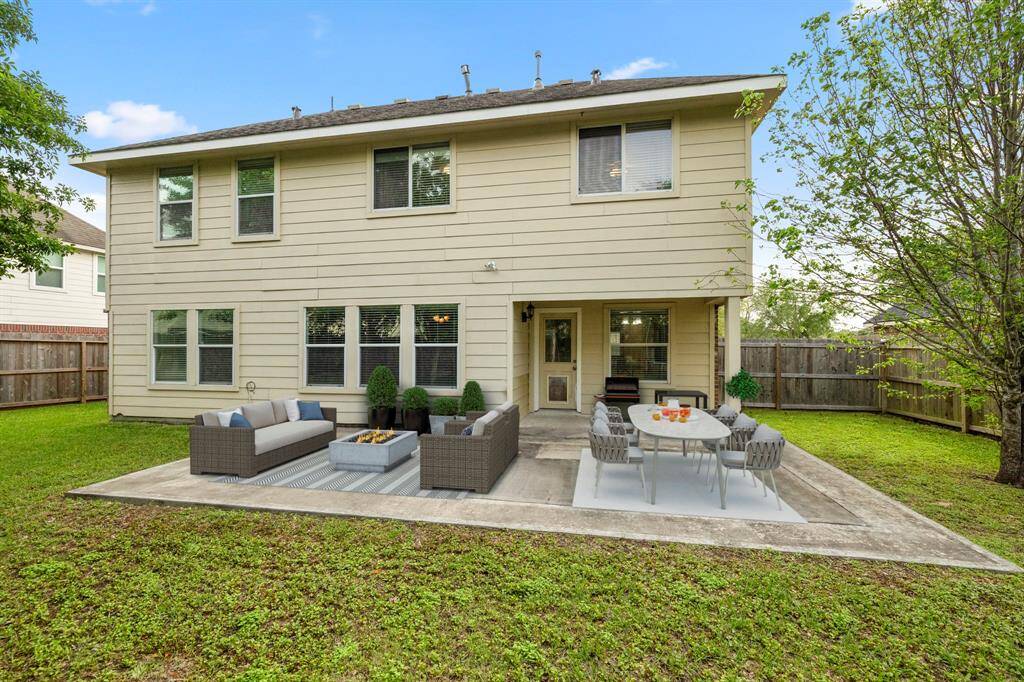 Outdoor living at its finest! The covered patio with extended concrete is perfect for your outdoor living space, patio furniture, or BBQ pit! It connects to the main living area making it great for indoor/outdoor living and entertaining. *This photo has been virtually staged