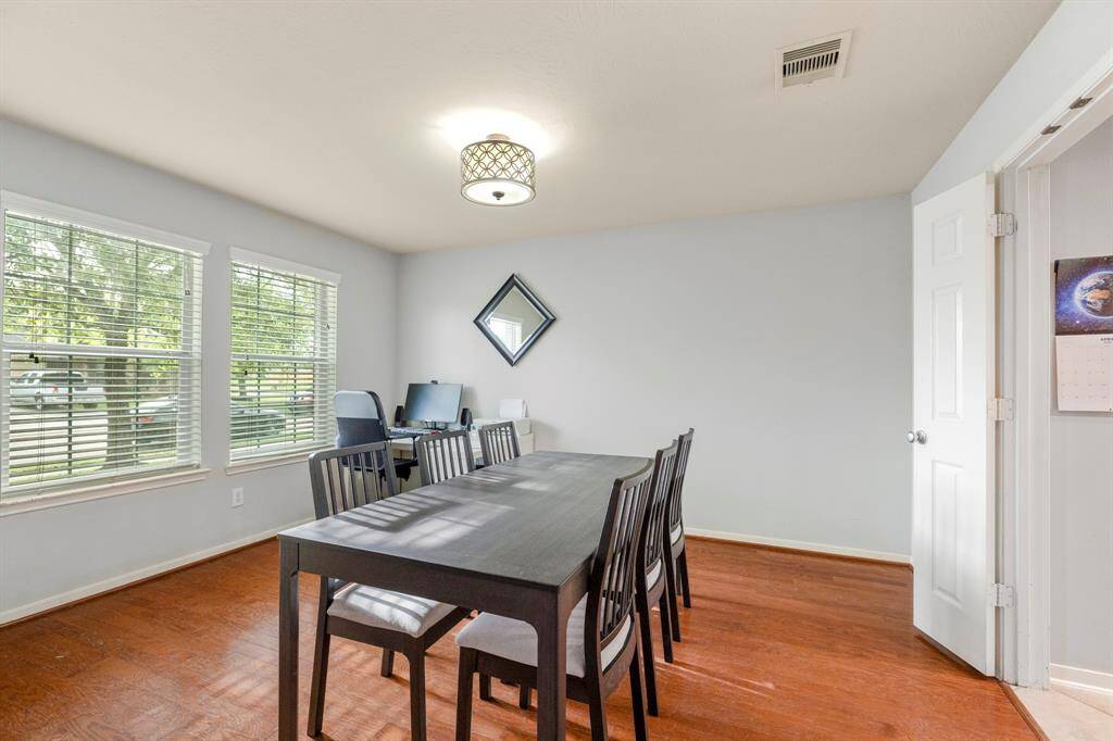 Endless possibilities await in this spacious bonus room! With expansive windows overlooking the front yard and double doors leading to the kitchen, this versatile space is ready to transform. Whether you envision a dining room, a cozy library, home office, or something entirely your own—this room adapts to fit your lifestyle.