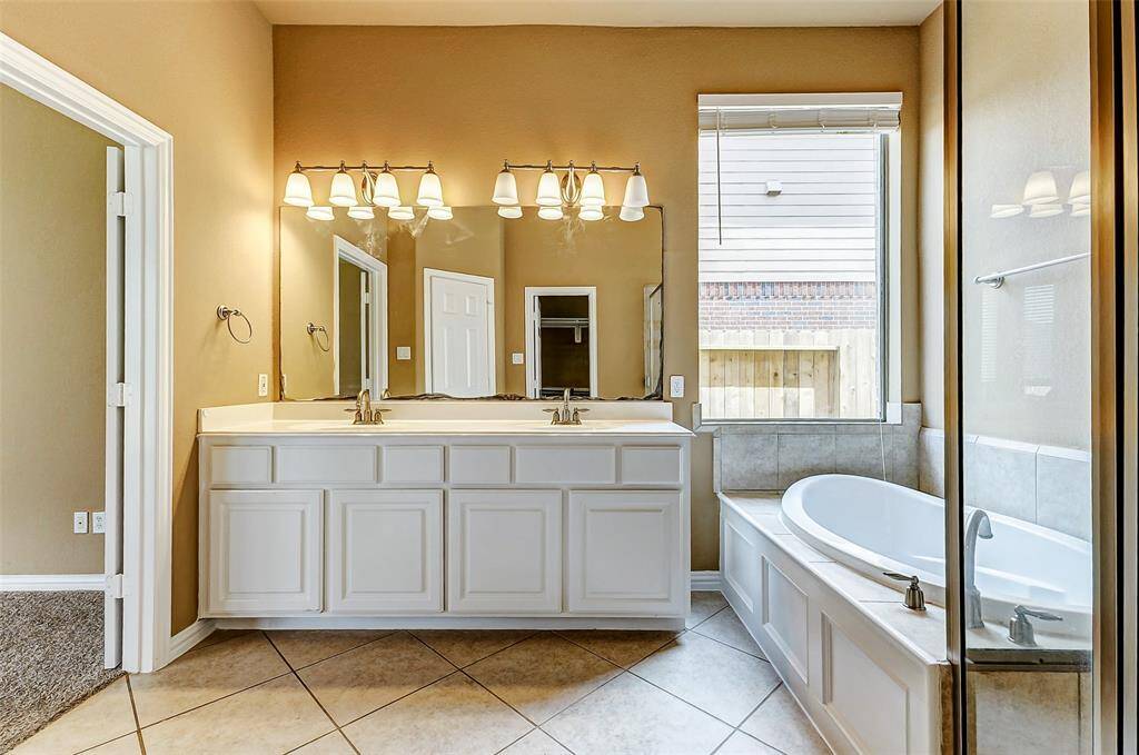 spacious soaking tub, elegant double vanity