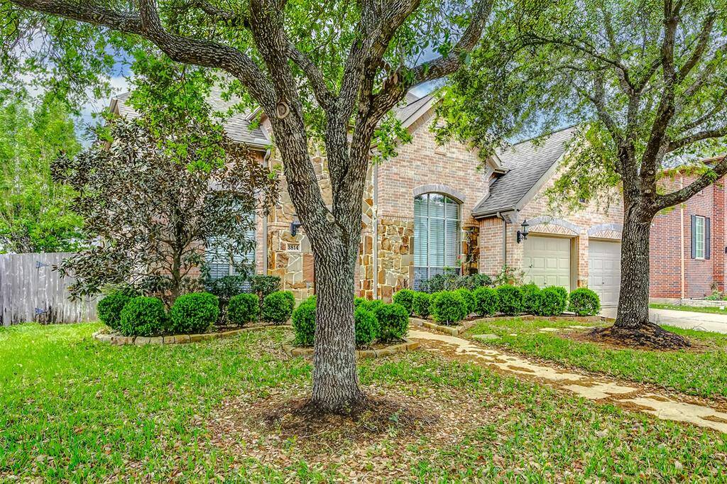 welcoming front path and manicured landscaping