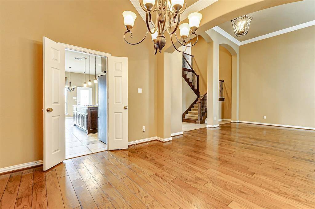 This is the dining room, looking into the kitchen through the double doors.