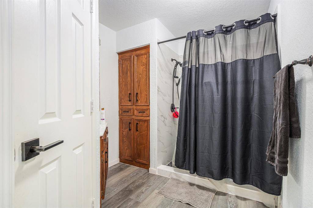 A view of the secondary bathroom which is located right off of the living area.