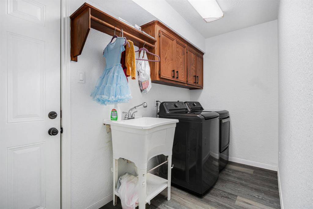 Utility room is in the house. It also comes with a separate sink, great for cleaning and washing to stay in the utility room. Washer and Dryer will stay with the property. Electric and gas connections for the dryer.