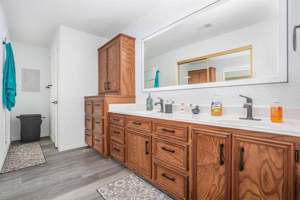 Extra storage and cabinetry throughout the primary bathroom making it easy and convenient.