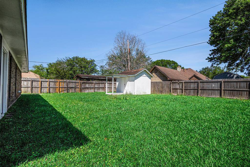 A view of the backyard. Plenty of space for backyard activities and even a pool for the future.
