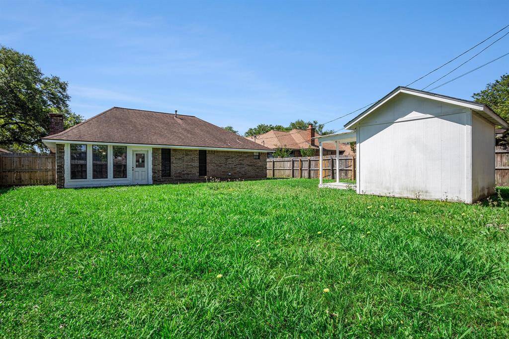 A view of the exterior home and shed.