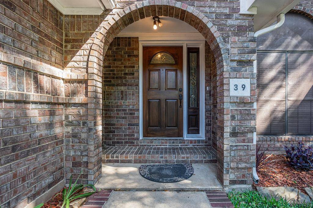Beautiful entryway with a solid wood front door.