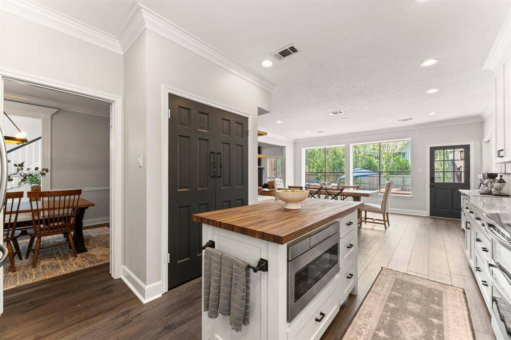 Check out the custom double pantry doors! The microwave is hidden in the island!