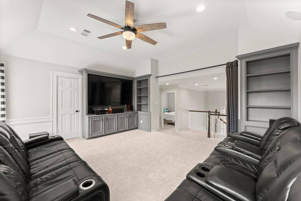 Custom built-ins in the game room and LARGE attic space off this room