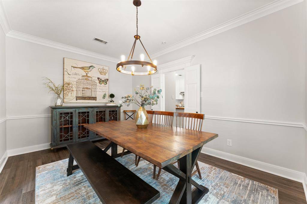 As you enter the home, the dining room is on the right and has a door leading to the kitchen.
