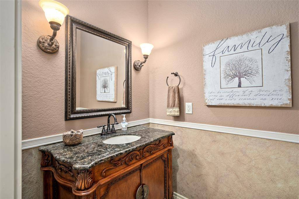 The powder room is located next to the living area.