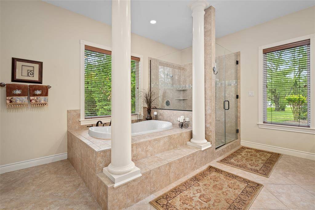 Enjoy the luxury of a dual shower setup and large bathtub.