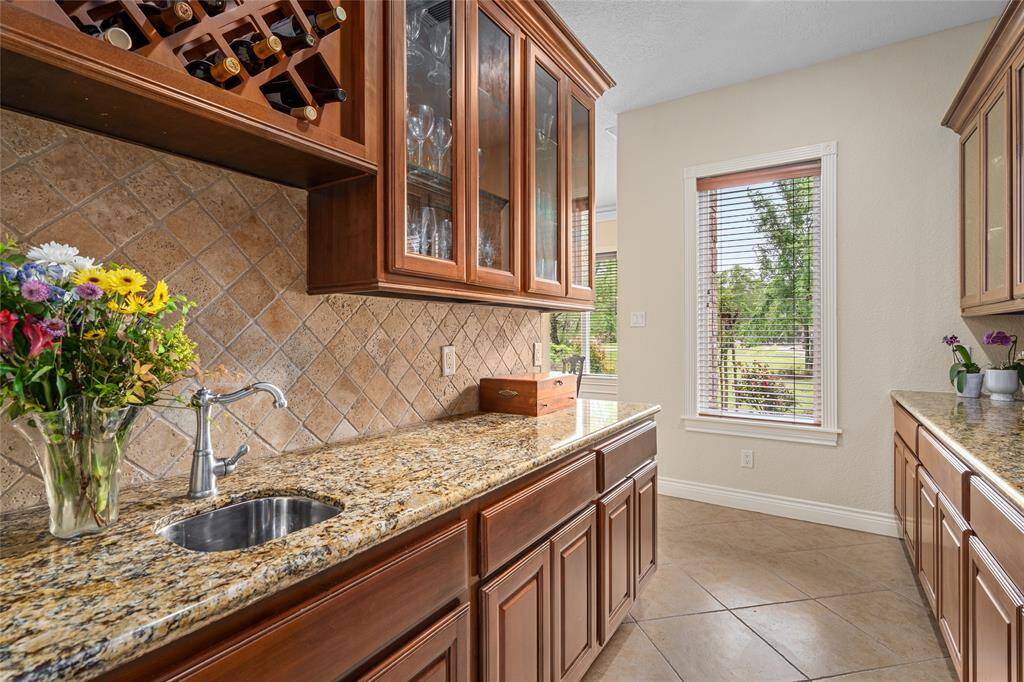 A convenient butler's pantry connects the kitchen to the dining room, offering additional storage and a seamless flow for entertaining.