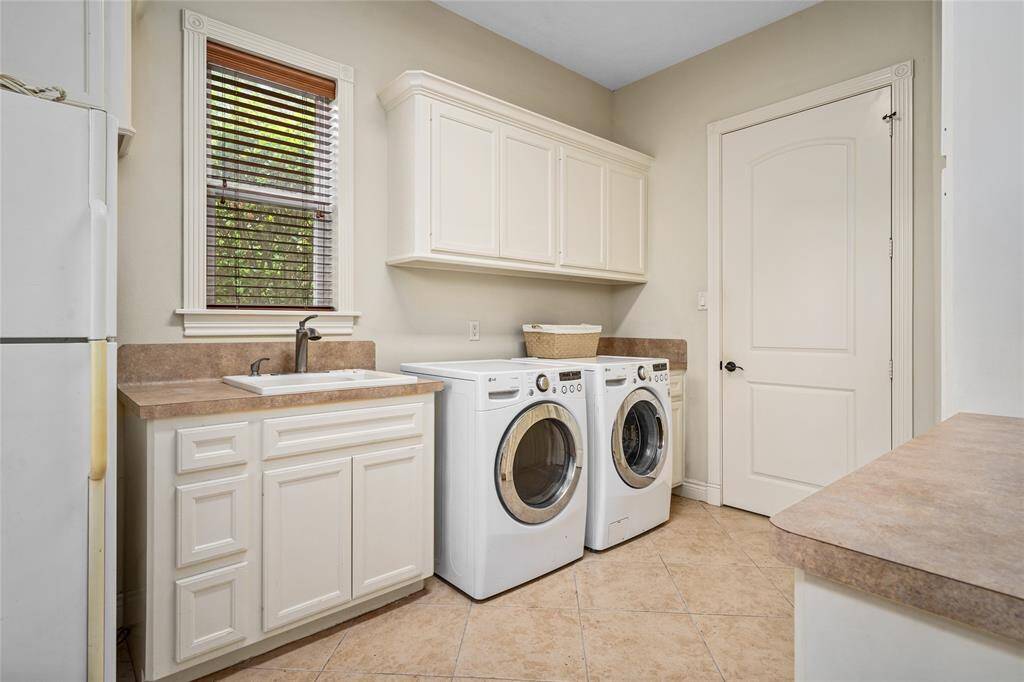 The utility room, with extra storage is located next to the kitchen.