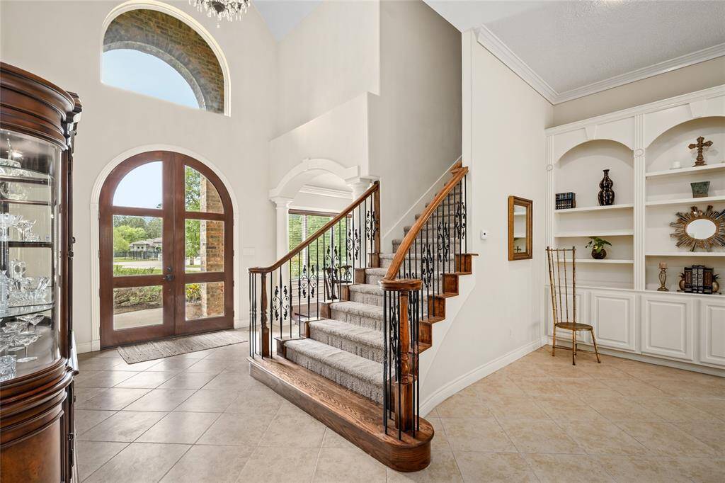 The stairs at the front of the home leads you to additional secondary bedrooms.