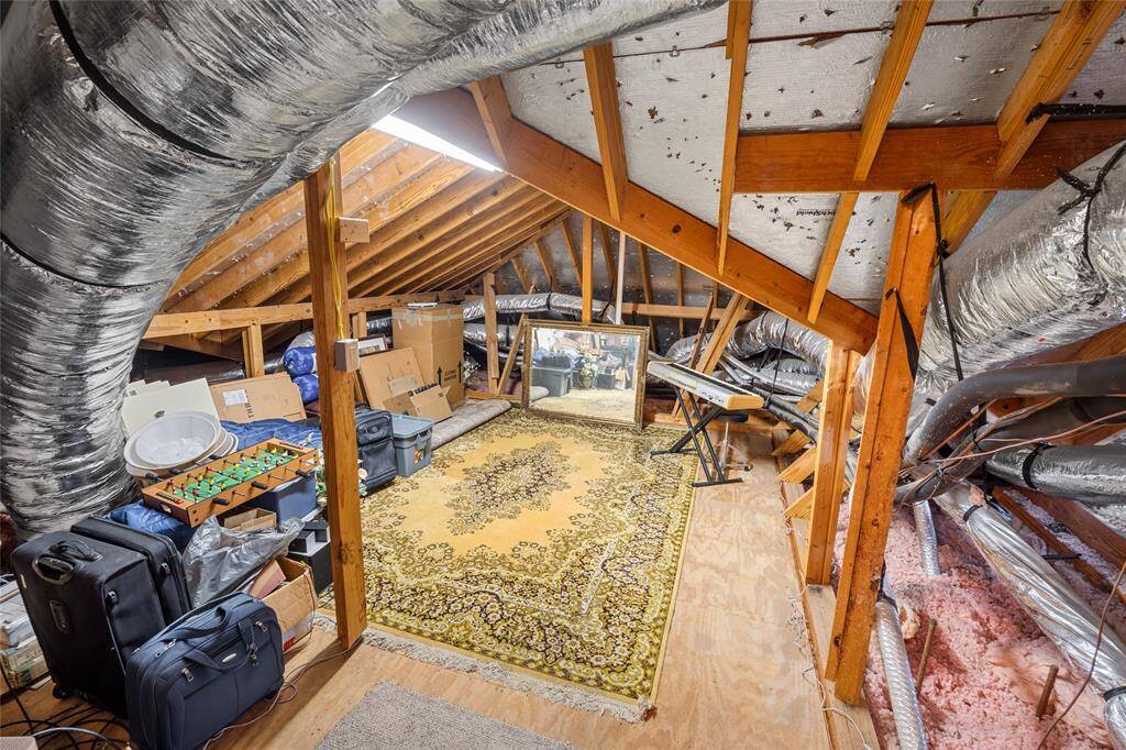 Connected to the game room is the large walk-in attic space.