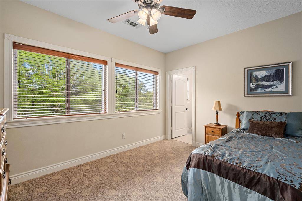 Large windows throughout the home fill each room with natural light.