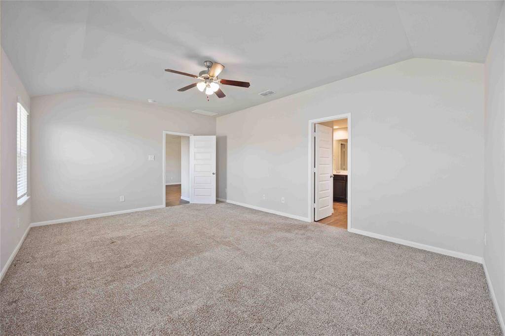 Primary bedroom offers plenty of space for all your large furnishings. These neutral colors allow tons of potential to make this space truly your own.