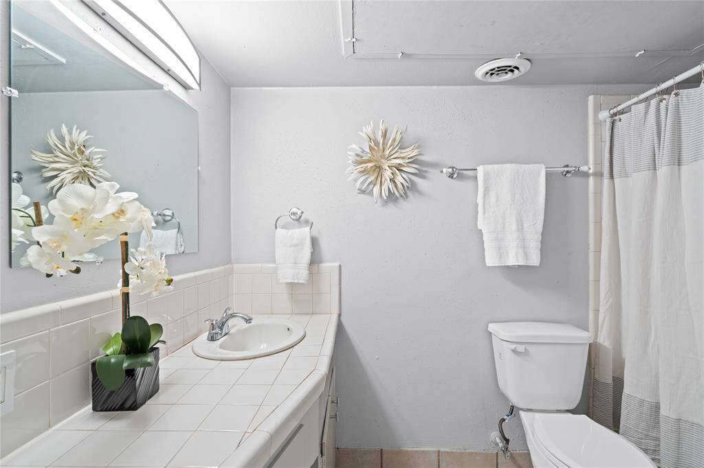 A second full bath features a tub and shower combo. It is easily accessible from any room in the house.