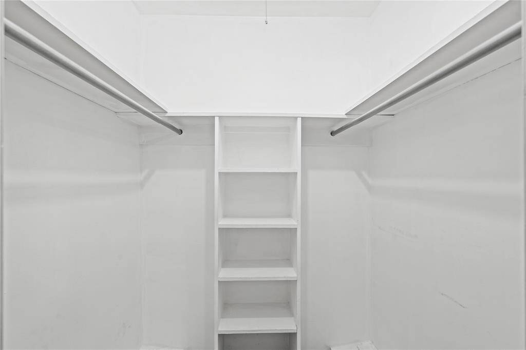 The closet in Bedroom 3 also includes some built-in shelving.