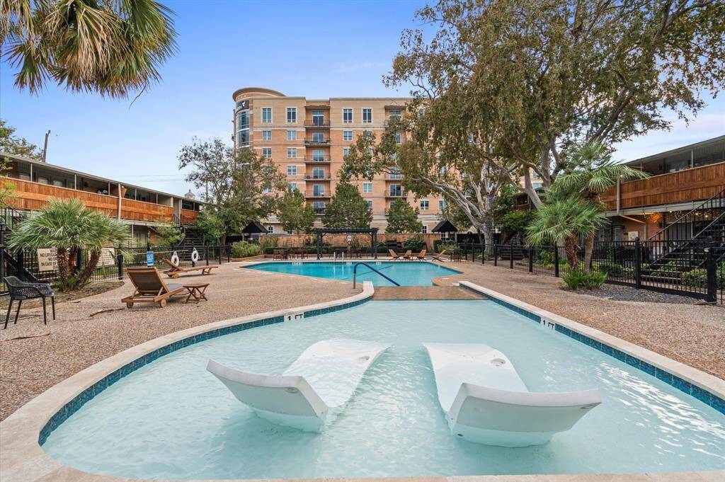 A community pool rests inside this well-cared-for gated community.