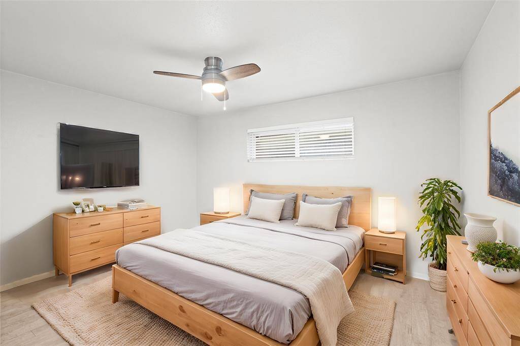 Enjoy a comfortable primary bedroom that offers plenty of space for a suite of furniture.