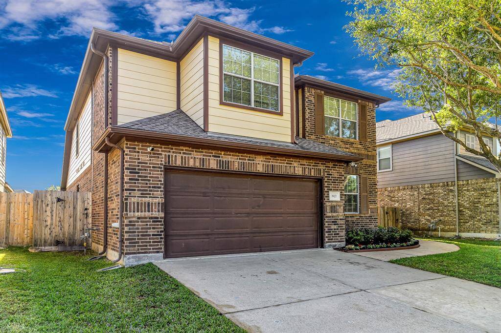 Two car garage with double wide driveway