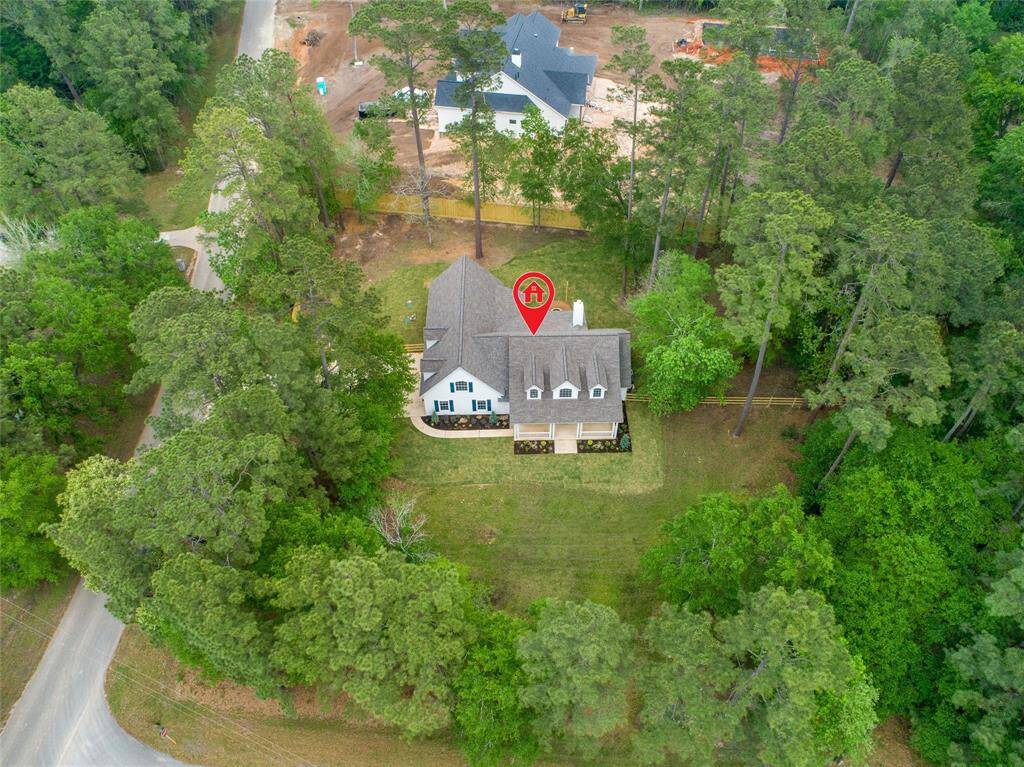 This aerial view of home, buyer should verify boundaries.