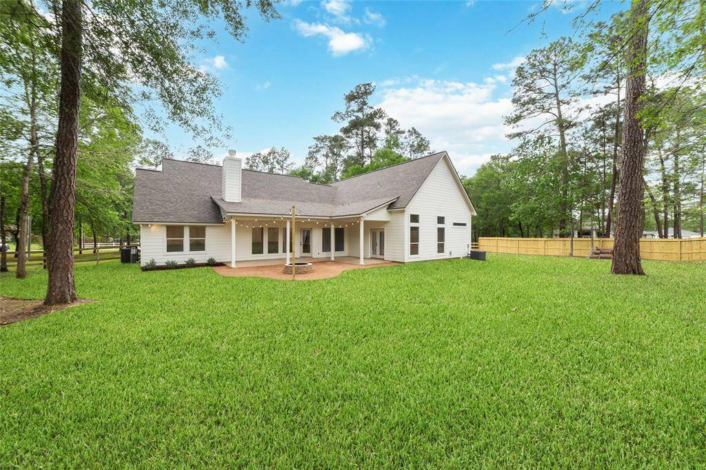 Expansive 1+ acre lot offering endless possibilities for outdoor living and enjoyment.