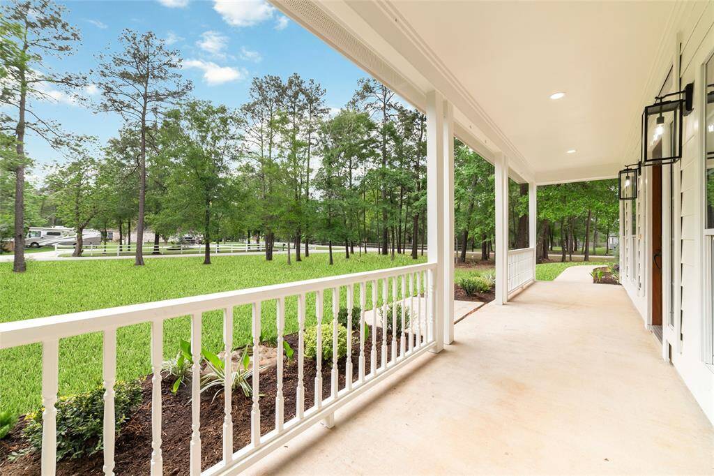 Gorgeous front porch perfect for dining and enjoying your morning coffee.