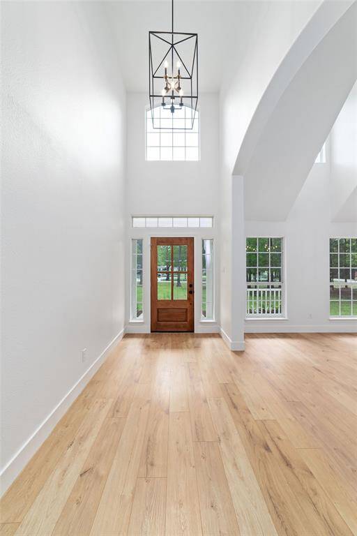 Breathtaking entryway with soaring ceilings, offering an impressive welcome.
