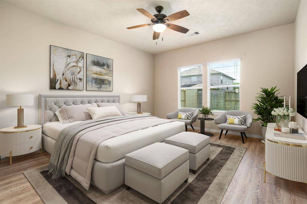 What a wonderful place to come home to, this stunning primary suite greets you with gorgeous wood floors, a warm custom paint, high ceiling, ceiling fan with lighting, lovely windows with blinds allowing in natural light brightening up this spacious primary bedroom, with extra space for a seating area. *Virtually Staged