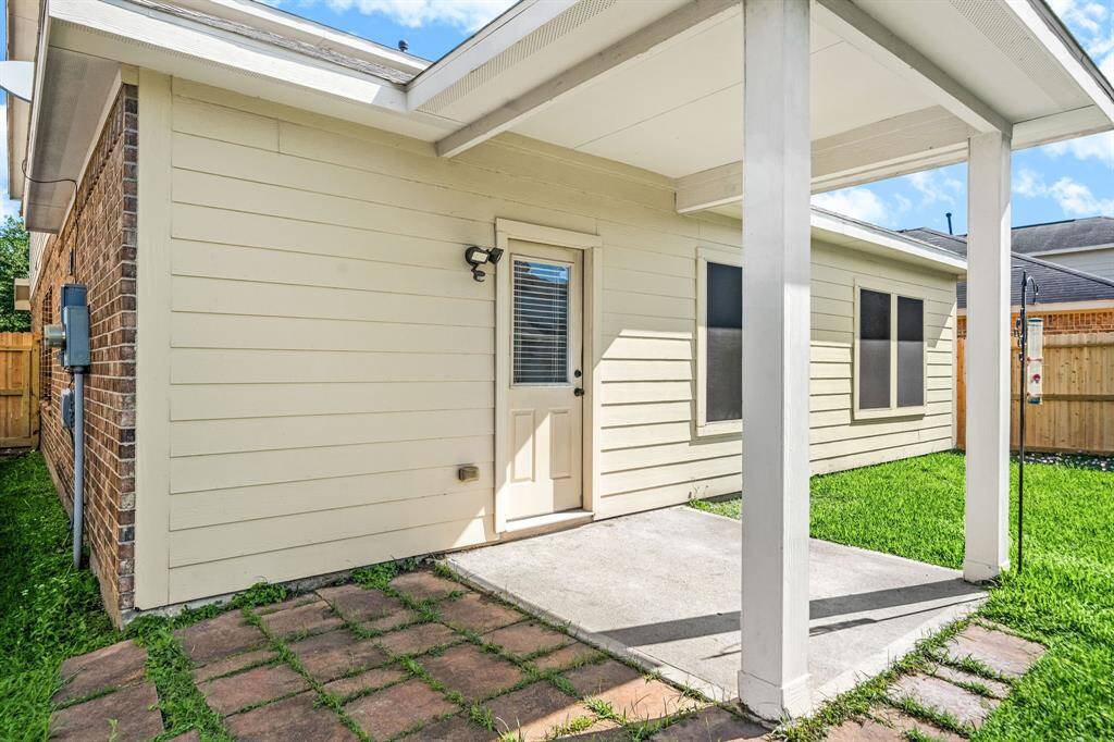 Come and see this spacious backyard with its beautiful covered patio and paved walkway down the side yard. There is plenty of room for the kids to play and adults to relax! Perfect for your outdoor living space, patio furniture, bbq pit, and so much more. The possibilities are endless!