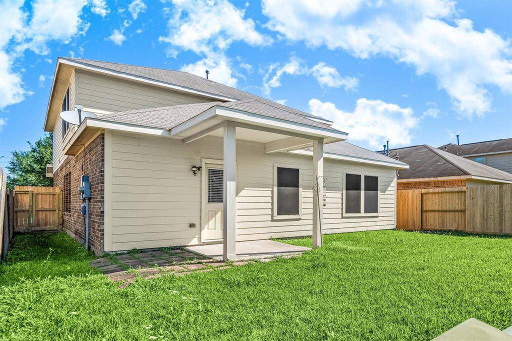 Come and see this spacious backyard with its beautiful covered patio and paved walkway down the side yard. There is plenty of room for the kids to play and adults to relax! Perfect for your outdoor living space, patio furniture, bbq pit, and so much more. The possibilities are endless!