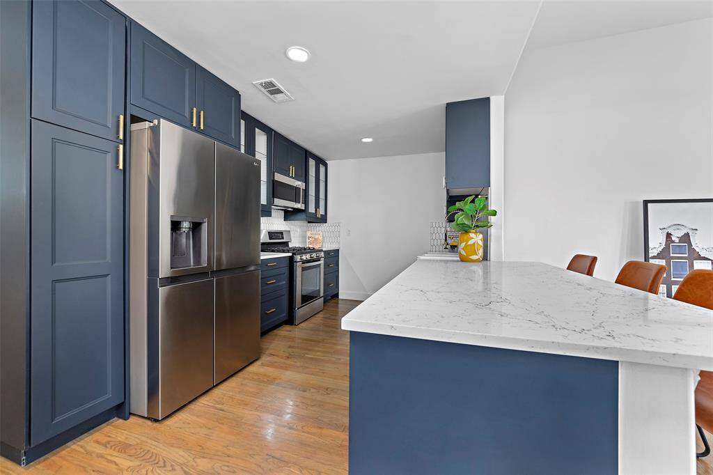 Fully updated kitchen has gas range, butlers sink and lots of storage
