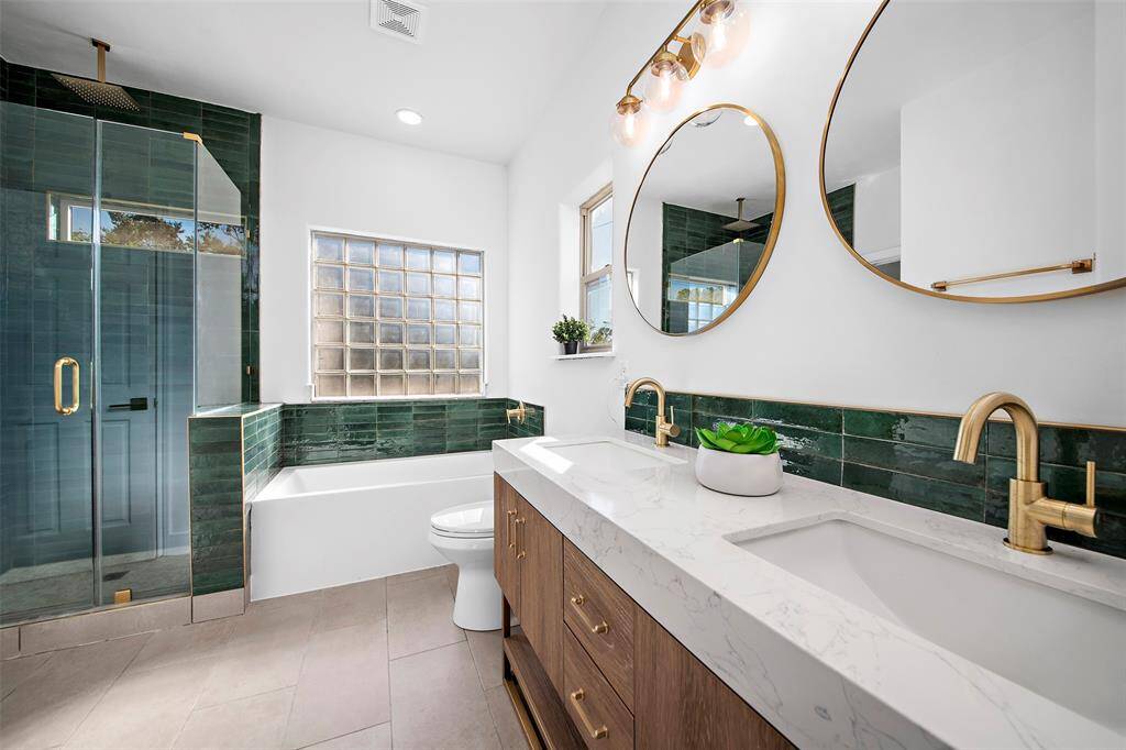 Walk-in shower, bath and double sinks.